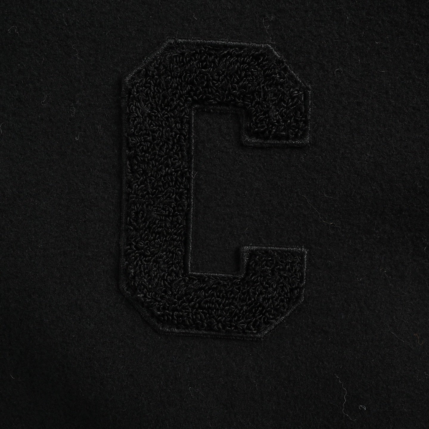 Woolen hooded coat with leather sleeves